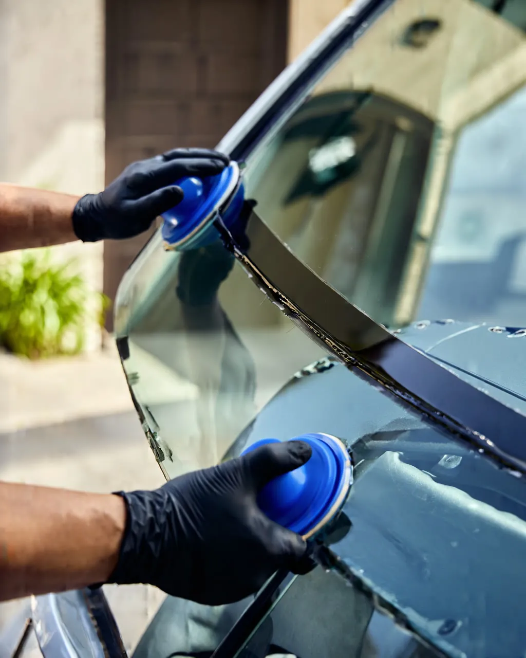 Technician setting a new windshield